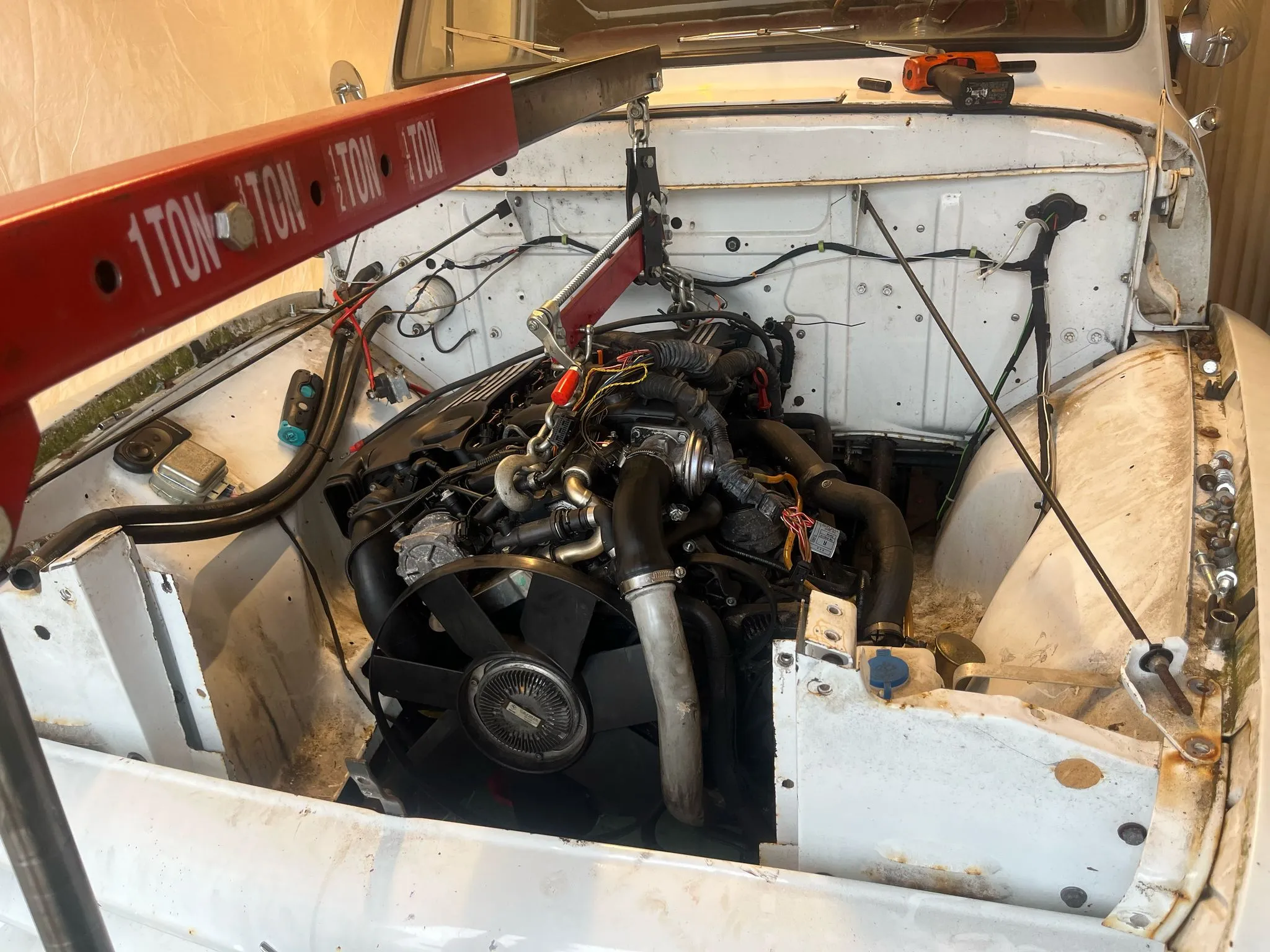 The engine compartment of a truck with wires and wires attached to it.