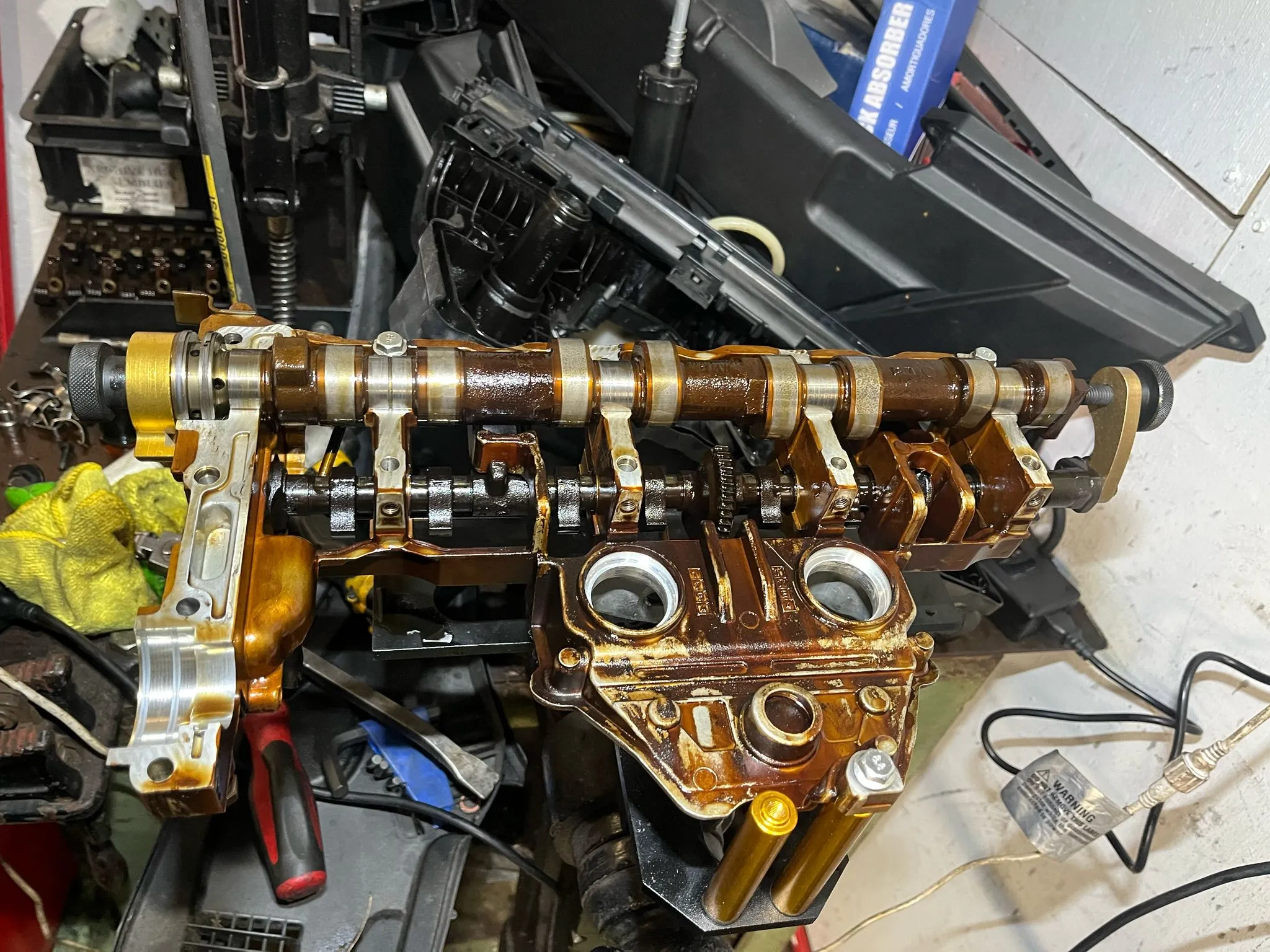 A close up of an engine in a garage.